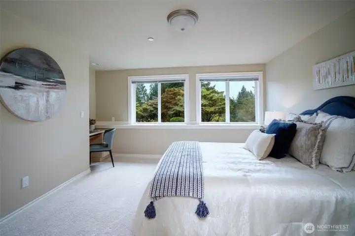 Lower level includes four spacious bedrooms with new paint, carpet, built-in desk and closets organizers. They are situated on either side of of the family/media/game room and hallway full bath; two on each side.