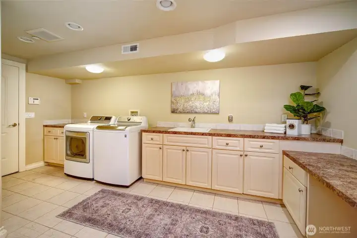 Expansive, funtional, laundry; connects to the garage.