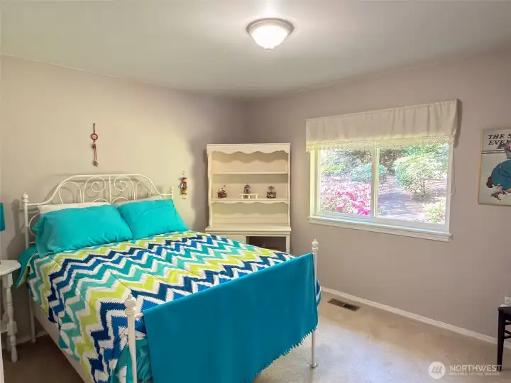 Guest bedroom with garden view.