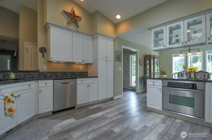 Beautifully updated kitchen with granite countertops, plenty of counter space and storage