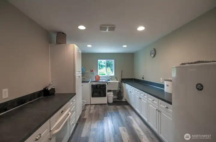 Oversized laundry room with no lack of storage. Oven number 2 comes in handy for those large gatherings