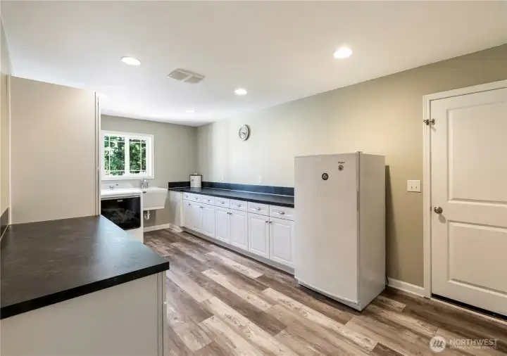 HUGE laundry room with more storage