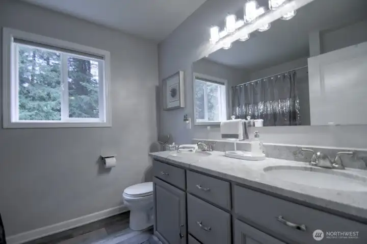Recently updated main bathroom with quartz countertops and double sink