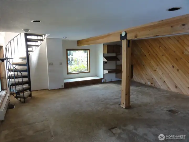 Game room big enough for a pool table. Spiral staircase leads to the family room.