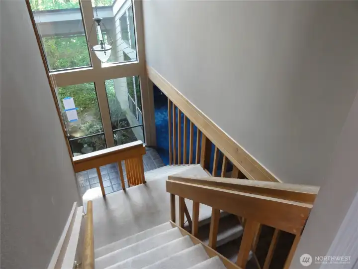 Stairs to the upper floor can be reached from the entry way or the kitchen.