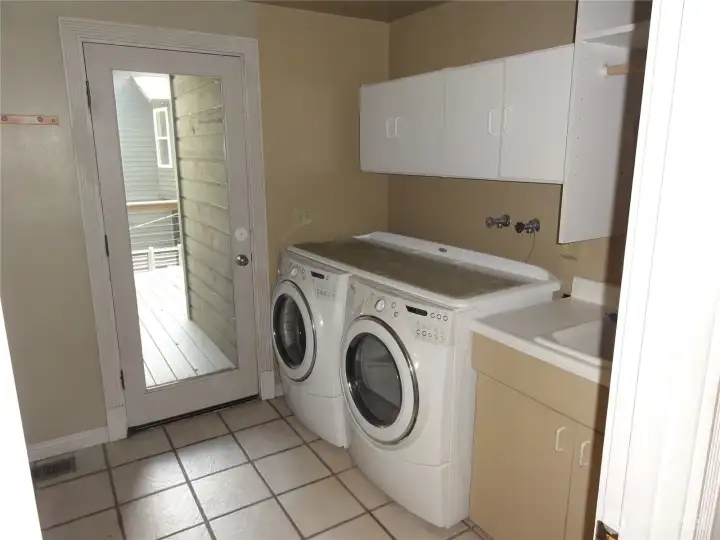 Laundry room that also leads to the garage.