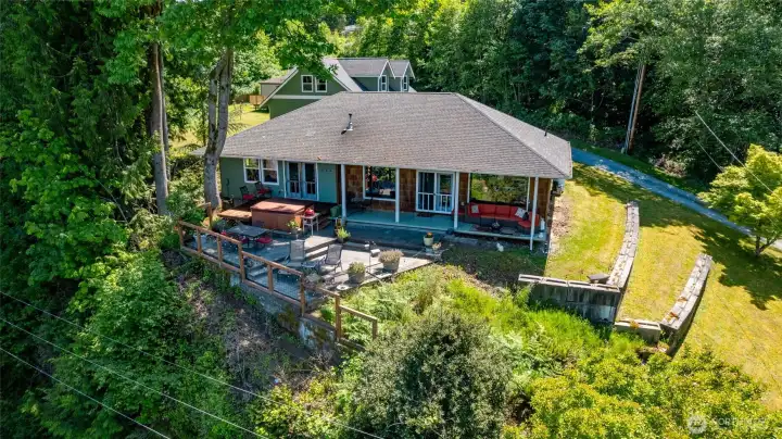 Home overlooks Big Lake.  A covered deck and paver patio offer plenty of space for outdoor living and entertaining.