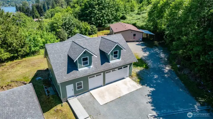 42x28 shop, 3 bay garage, with unfinished loft. Plumbing stubbed in for your future bathroom.  Loft could be ideal work from home space, or a home-based business, guest quarters, or just a great entertaining space.