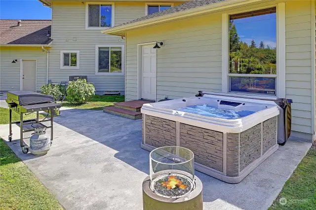 Sit and relax in the jetted hot tub, surrounded by nature, and complete privacy on the back patio.