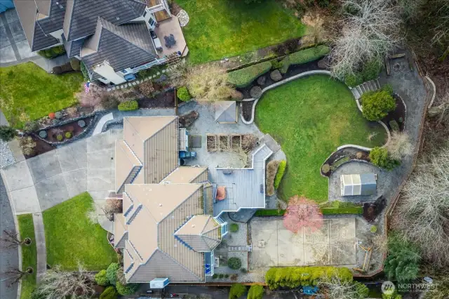 Great view of everything outside; large front yard, basketball/pickleball court, greenhouse with water accessible, firepit, lucious landscaped yard, garden beds, deck with gas hookups, private juliette deck off primary bedroom, shed, and so much more to see.