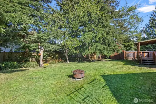 Oversized partially fenced back yard