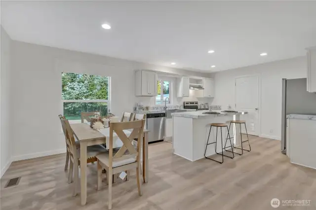 view of the dining room and kitchen from living room