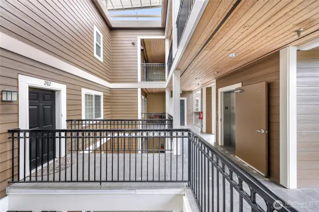 Main entry leads directly to elevator & stairs