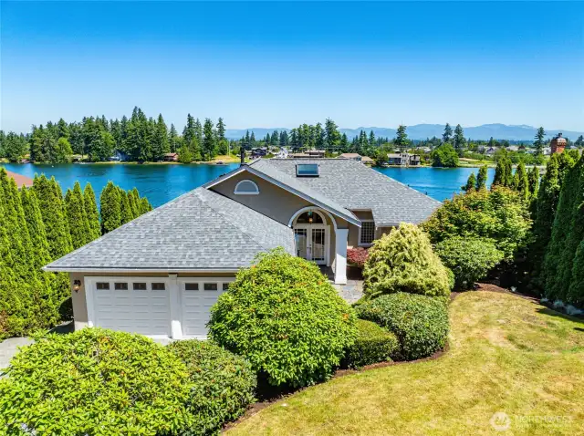 Front view of this spectacular home with a brand new 50-year transferrable roof.
