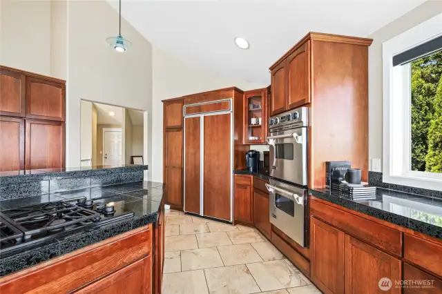 Chef's kitchen with gas cooktop and double oven.