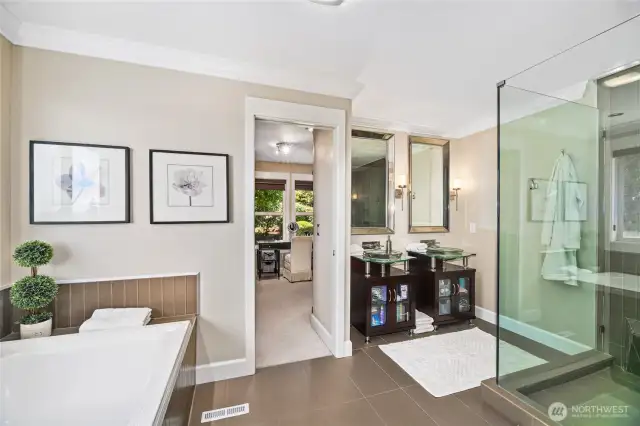 Five-piece primary bathroom leads to a fabulous walk-in closet.
