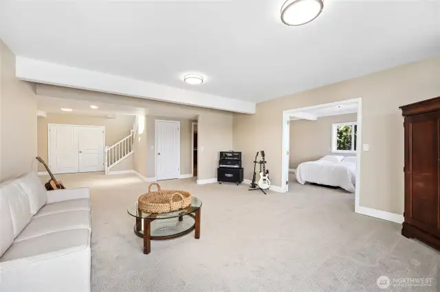New carpeting on lower level. The second primary bedroom suite is to the right.