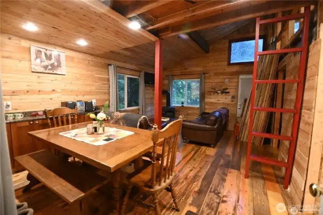 INTERIOR BOASTS OPEN CONCEPT LAYOUT, windows that frame the surrounding forest views, total cabin comfort.