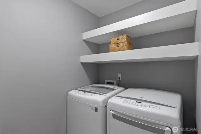 Upstairs laundry room with plenty of storage