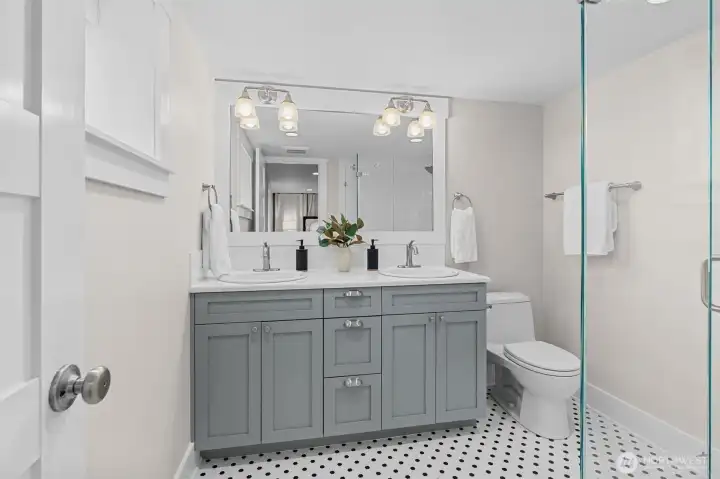 Beautifully appointed primary suite bathroom with elegant finishes and a clean, refined design.