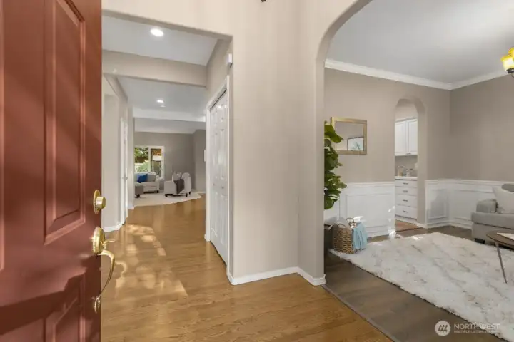 Step inside to a bright foyer with hardwood floors and classic millwork.