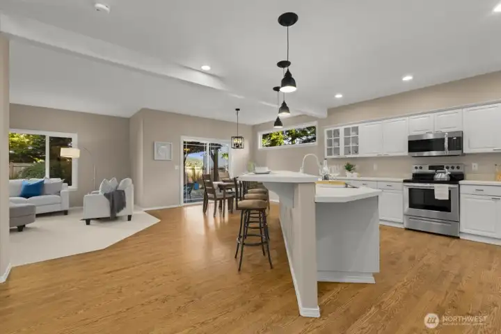 Open layout flows to the dining area and family room, ideal for gatherings.