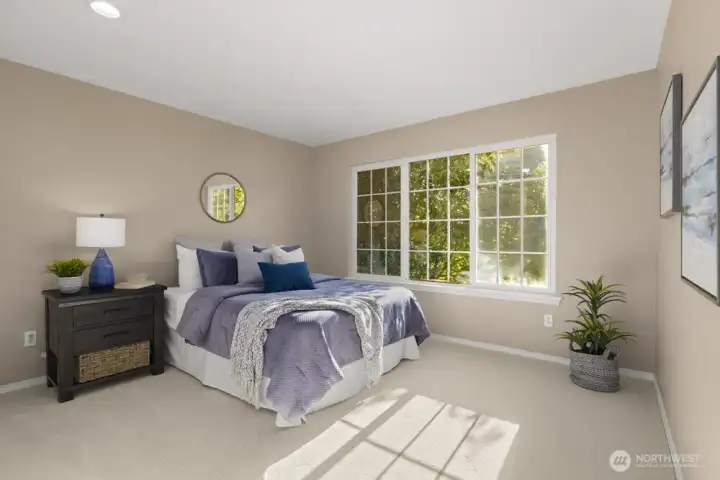Three additional bedrooms upstairs, each bright and inviting.