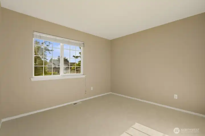 Upstairs bedroom with wonderful natural light and plenty of space.