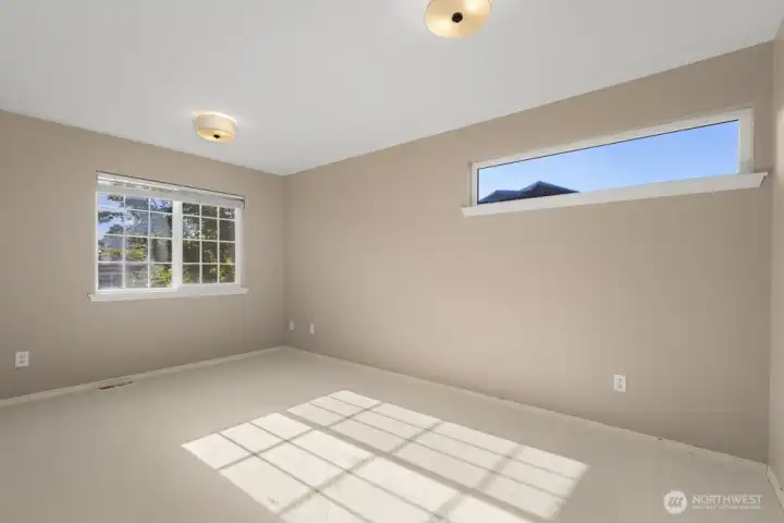 Versatile upstairs bedroom ideal for guests, office, or playroom.