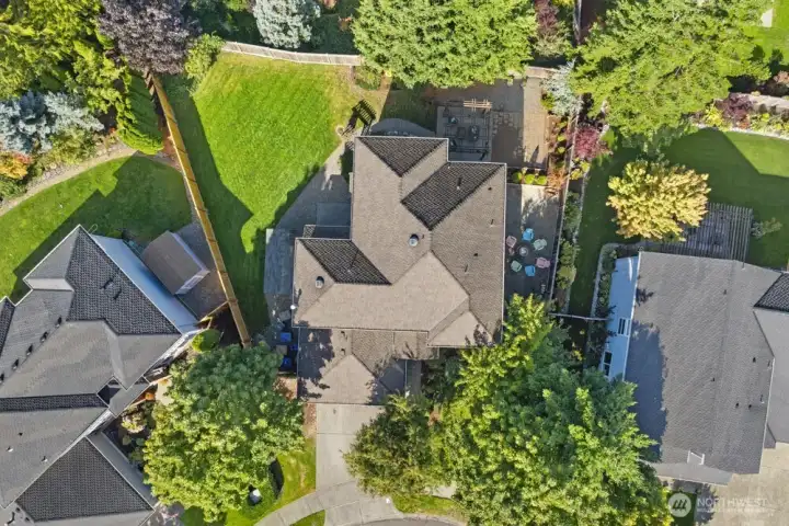 Bird’s-eye view highlighting the home’s generous lot, landscaped backyard, and outdoor living spaces.