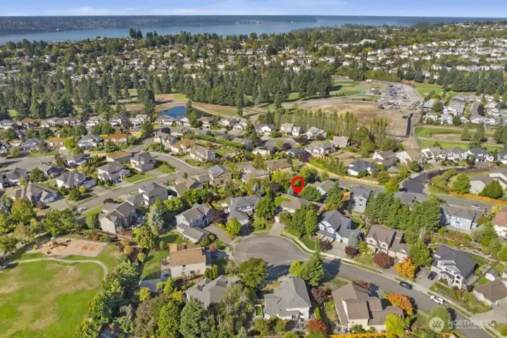 Convenient location near schools, shops, and golf course.