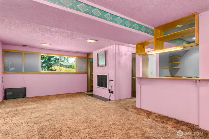 Lower level living space complete with wood burning fireplace and kitchenette