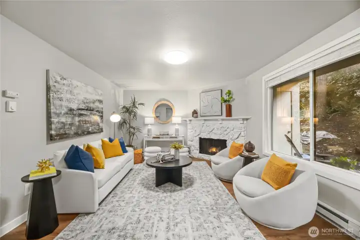 Spacious living room with fireplace and walk out patio/yard.