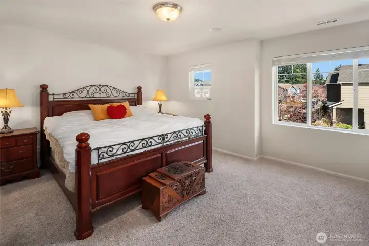Primary bedroom with fresh paint and new carpet