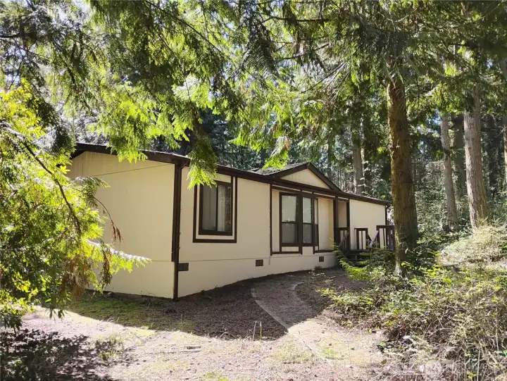 Here is a close up view of the front of the house which has a paved walkway. Here is a close up view of the front of the house which has a paved walkway.