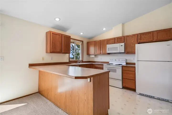 Kitchen with views of Ebey Slough and Olympics on a clear day!