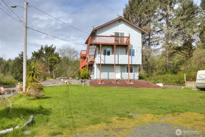 Bottom floor currently used as separate apartment, full kitchen, washer/dryer, full bath. Second floor 2 bdr, 3/4 bath, kitchen, living room, 3rd floor primary bedroom, full bath w/soaker tub, double vanity, walk in closet & catwalk to large deck overlooking Conner Creek.