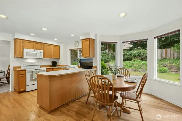 Beautiful informal breakfast nook area with a French door leading out to the backyard space.