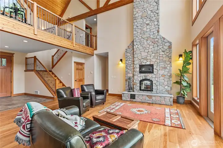 Floor to ceiling rock fireplace with buit-in masonry heater (Russian Stove).  Extremely warming in the winter!