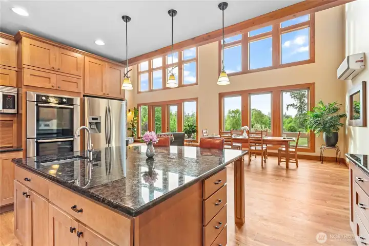 Chef kitchen with solid maple cabinets, granite counters and stainless-steel appliances.