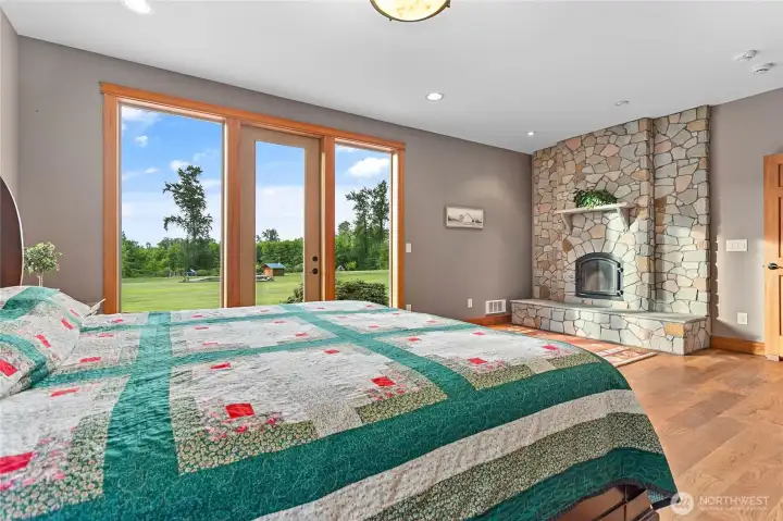 Primary with stone wood fireplace.