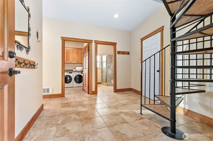 Second entrance with Custom solid cast iron spiral staircase.