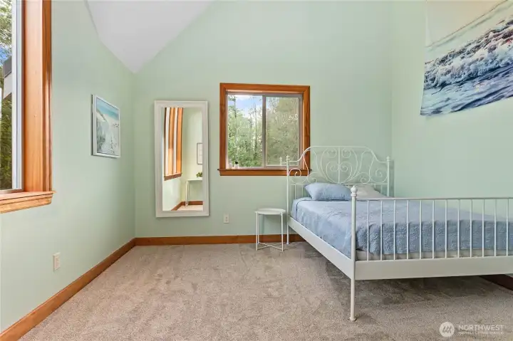 Both upper bedrooms have ceiling fans with ladders leading to lofts.