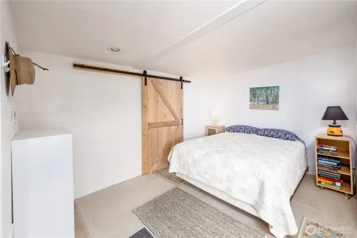 Large bedroom with sliding barn door closet. Large bedroom with sliding barn door closet.