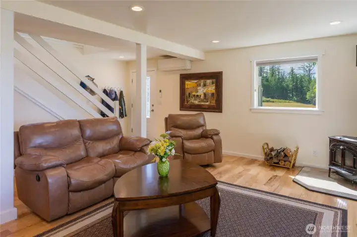 The family room has an exterior door opposite the stairway.