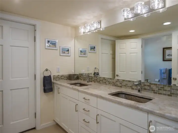 Lower lever bath has separate room with tiled shower.