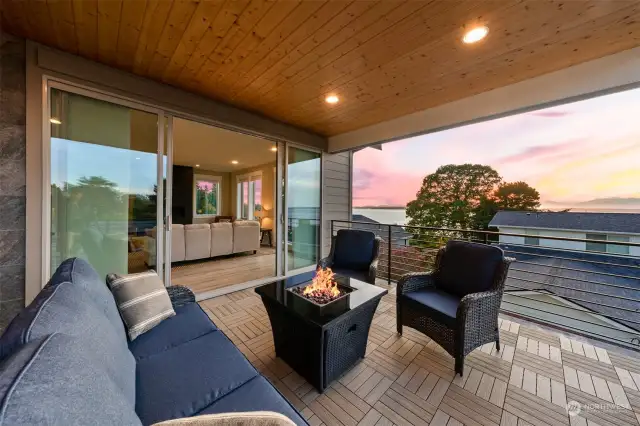 Covered deck with expansive views of Puget Sound