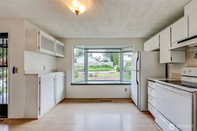 A surplus of cabinet space for all your dining and kitchen needs and plants will love the bay window!