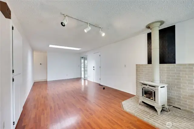 Off the kitchen is the large living room with a cozy fireplace. The room is large enough it could hold a dining table.
