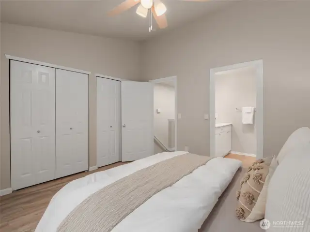 Primary bedroom vaulted ceilings and private suite